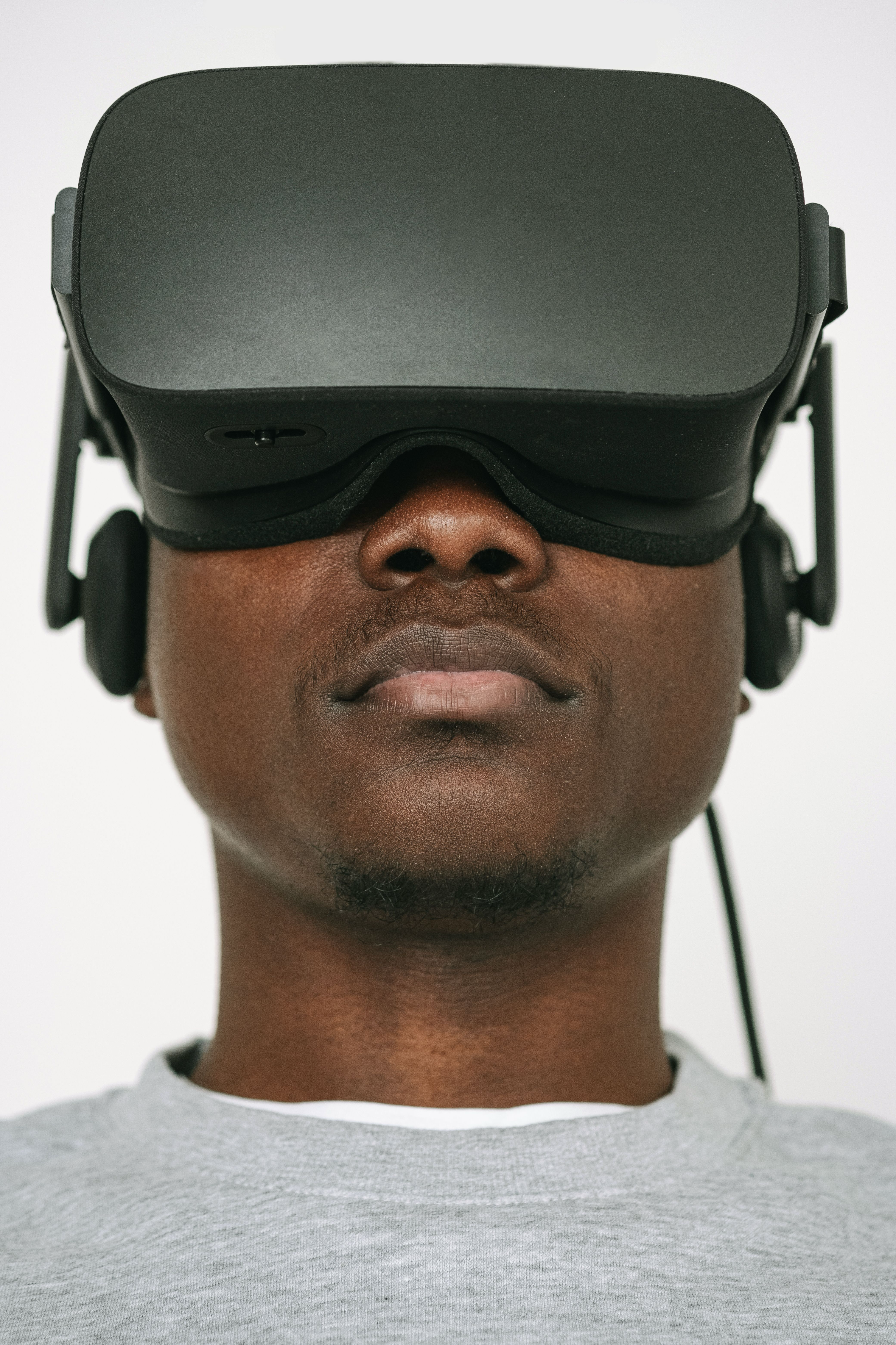 Portrait of a person wearing a VR headset. Nxtratechnology, built for what comes next.